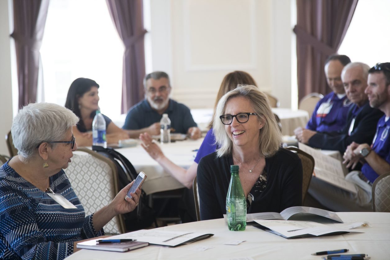 Members talking at a convening table